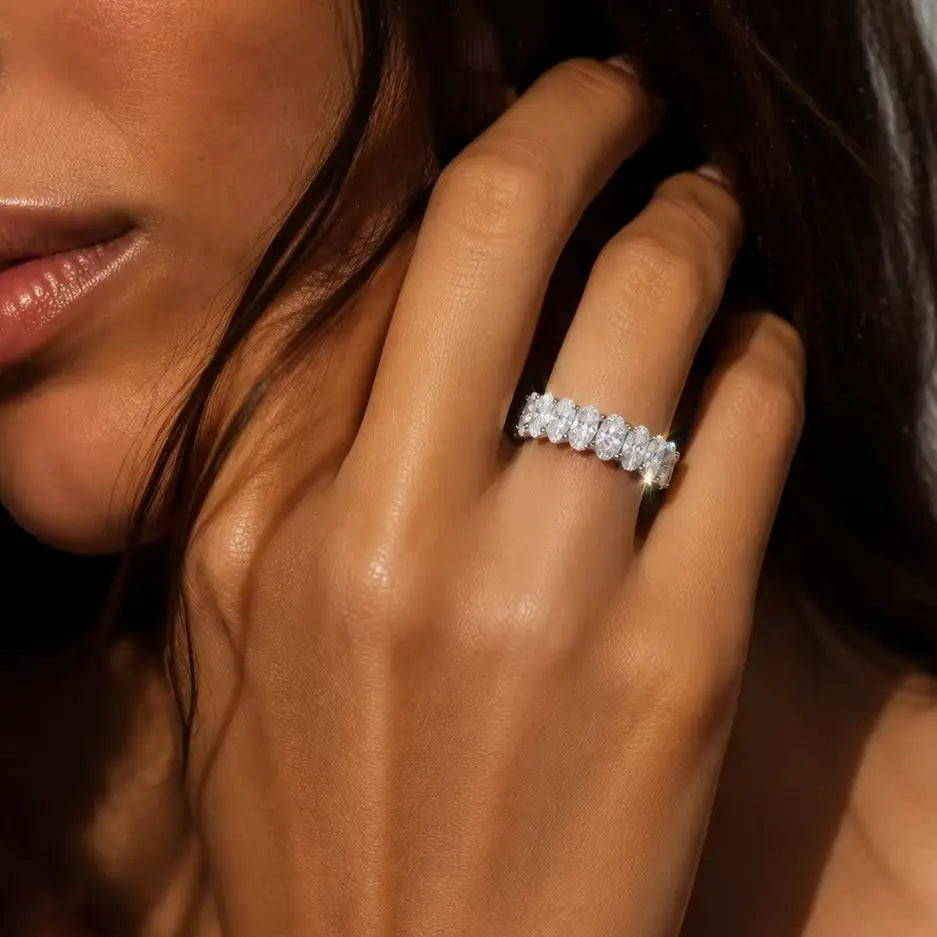 A Simple Unisex Couple's Ring in 925 Sterling Silver with a 2.1-Carat Oval Moissanite, Perfect for Dates and Parties.