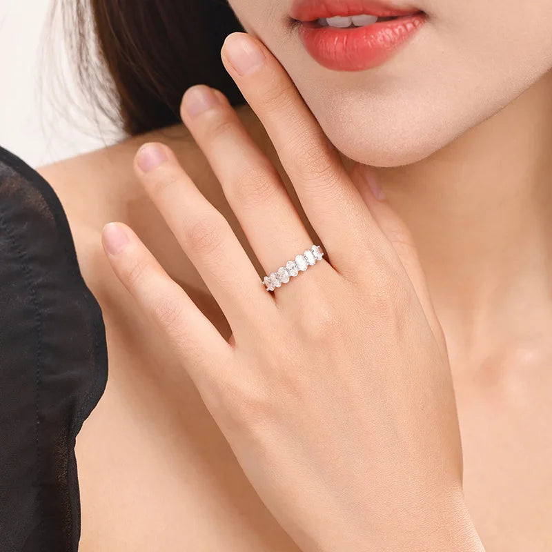 A Simple Unisex Couple's Ring in 925 Sterling Silver with a 2.1-Carat Oval Moissanite, Perfect for Dates and Parties.